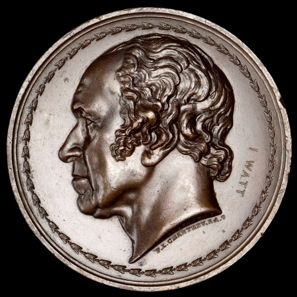Bronze medal with left-facing profile in deep relief of a man with wavy hair, sideburns, a high forehead and Roman nose. The disk is encircled by a laurel wreath and engraved on the right with the name I Watt.